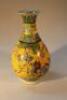 A Chinese export Ming style yellow ground bottle vase