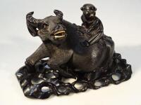 A 20thC Chinese hardwood carved figure of a Water Buffalo being ridden by a child