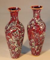 A pair of 20thC Chinese slender baluster vases