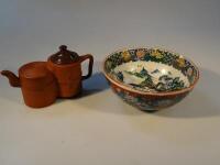 A 20thC Chinese yi xing double terracotta teapot and a Japanese decorative polychrome bowl (AF)