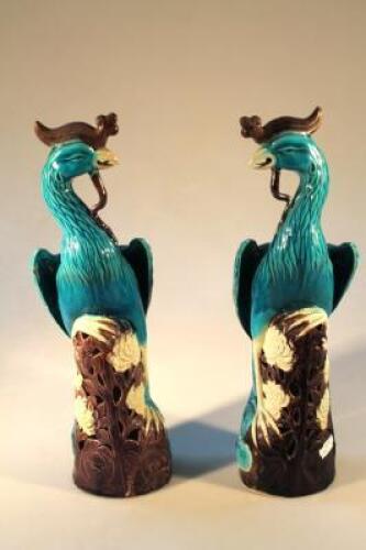A pair of 20thC Chinese moulded figures of Phoenix birds