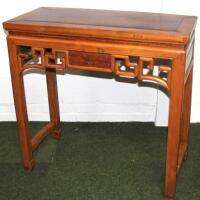 A Chinese hardwood carved table