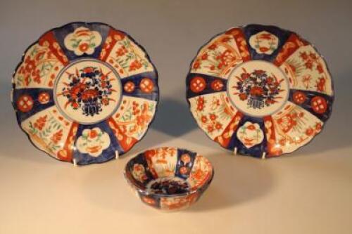 A pair of Japanese 19thC Imari basket pattern dishes