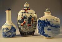 Three blue and white decorated pottery snuff bottles.