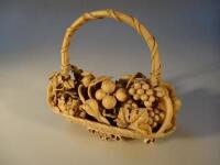 A Japanese Meiji period carved ivory fruit basket