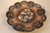 A large Cloisonne charger with shaped edge the central panel depicting a phoenix bird 46cm diameter.
