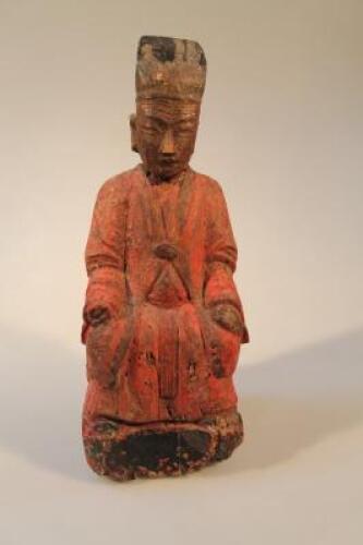 A Chinese carved wooden deity figure