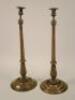 A pair of late 19th/early 20thC oak and brass candlesticks