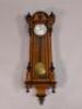 A Vienna type walnut and ebonised wall clock