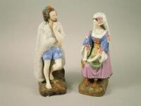 A pair of Russian Gardner Bisque porcelain figures of a fisherman and his wife