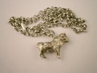 A silver bull pendant and chain