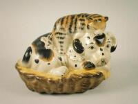 A 20thC Jordan ceramic group of a cat