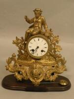 A French gilt metal figural mantel clock