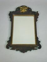 A mahogany fret frame wall mirror