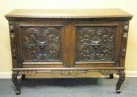 A carved oak sideboard