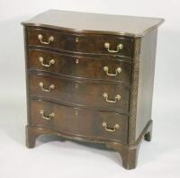 A mahogany serpentine chest of drawers in the George III style