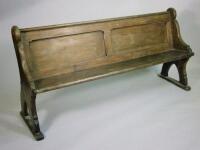 An early 20thC polished beech church pew