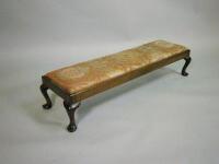 A mahogany long foot stool