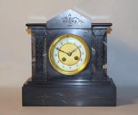 A 19th century French slate and marble architectural mantel clock