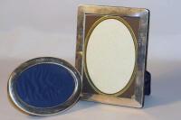 Two silver photograph frames