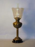 A Victorian brass paraffin lamp