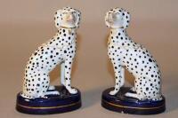 A pair of Staffordshire figures of seated Dalmations