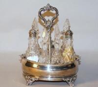 A Victorian silver seven bottle cruet