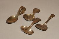 Four silver caddy spoons.