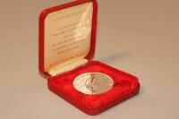 A Royal Maundy service solid silver medal.