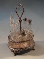 A Victorian silver plated six bottle table cruet