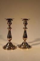 A pair of silver plated baluster candlesticks