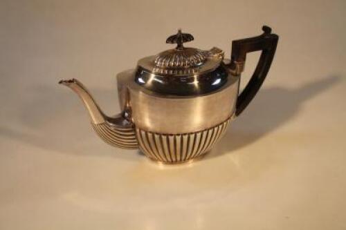 A silver plated semi-fluted teapot