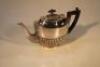 A silver plated semi-fluted teapot