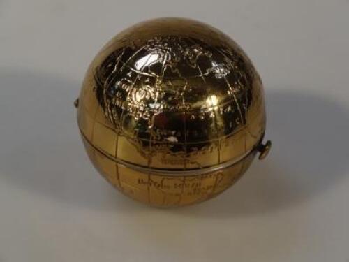 A Pygmalion ladies compact in the form of a globe