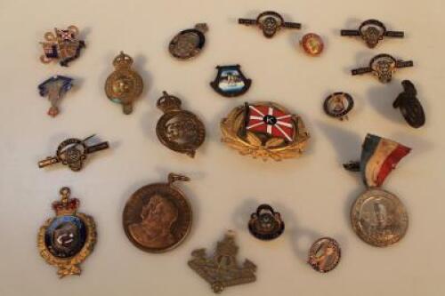 A collection of enamel badges and medallions