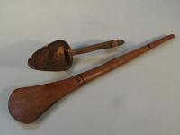 Tribal Art. A treen carved spoon and a small paddle