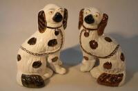 A pair of 20thC pottery spaniels