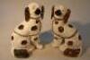 A pair of 20thC pottery spaniels