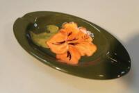 A Moorcroft Hibiscus pattern oval ashtray