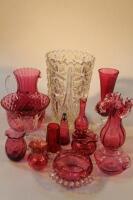 A collection of cranberry and other glass