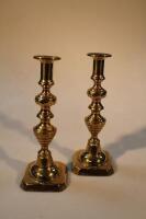 A pair of 19thC brass candlesticks