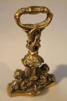 A 19thC cast brass door stop moulded with lions