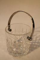 A cut glass ice bucket