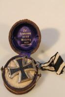 A German 1914 Iron Cross in its original velvet Picklehaub case.