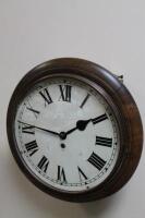 A circular oak cased fusee wall clock