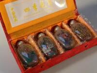 Four modern glass Chinese snuff bottles painted with birds.