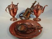 A pair of copper neo-classical style teapots