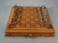 A 20thC turned metal chess set