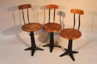 Three Singer sewing machine cast metal chairs.