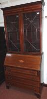 An Edwardian mahogany bureau bookcase